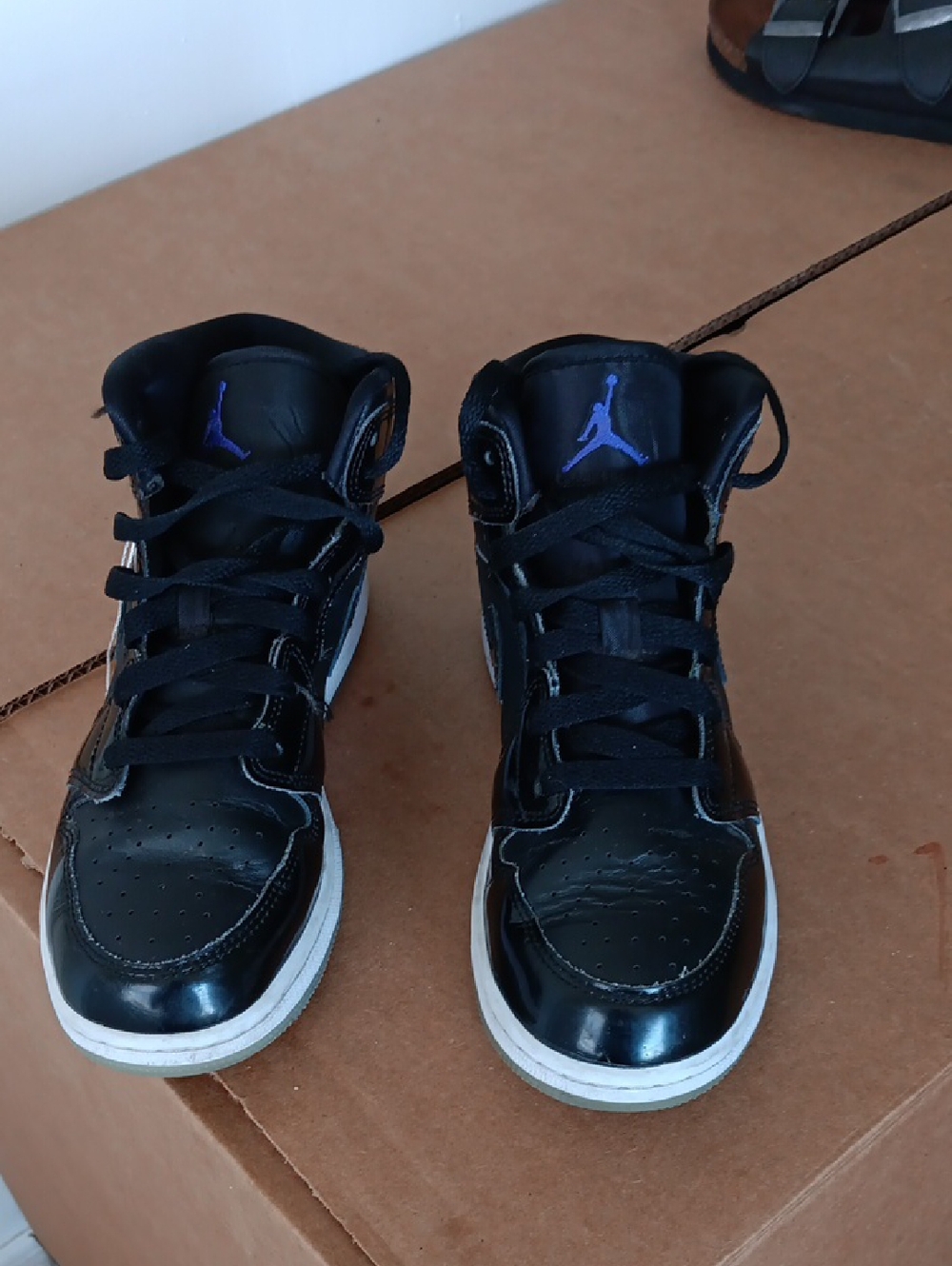 Nike Black High-Top Sneakers with Purple Jumpman Accent